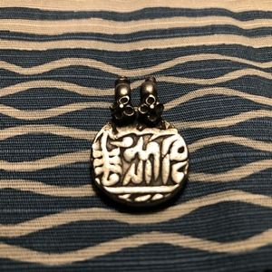 round indian silver pendant with arabic script